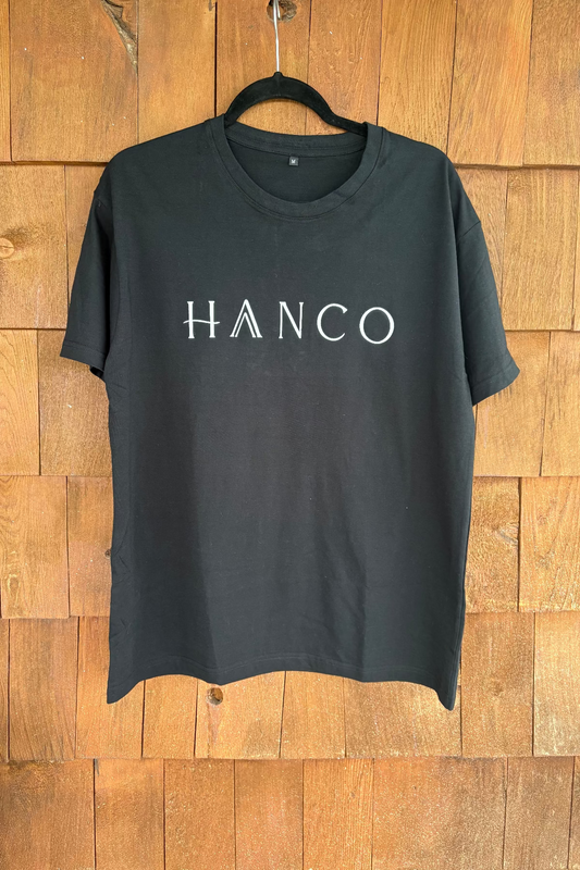 black t-shirt with hanco branding, wooden backgroung